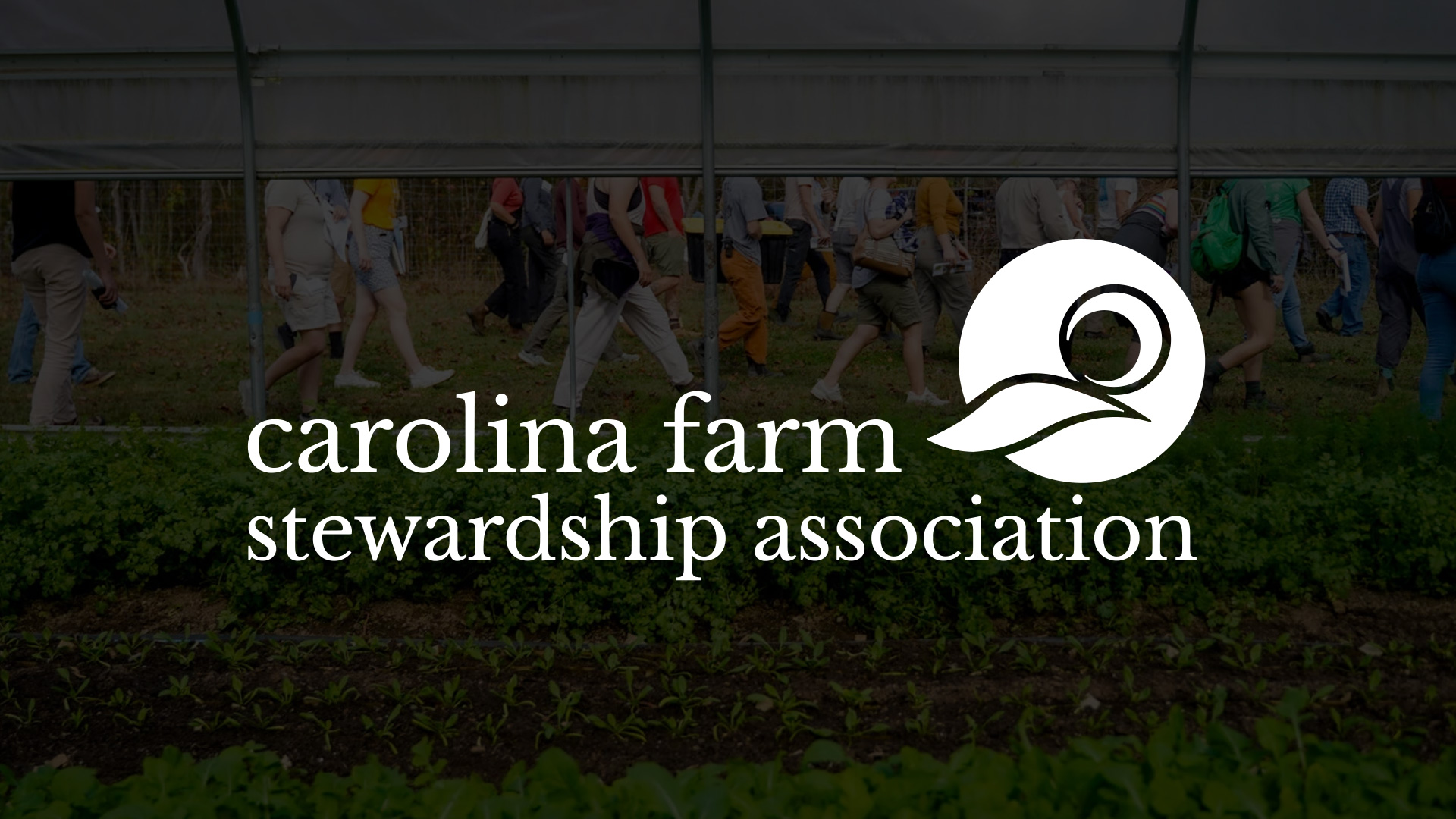 People walking through a field, with greenery in the foreground and a logo for the Carolina Farm Stewardship Association at the bottom.